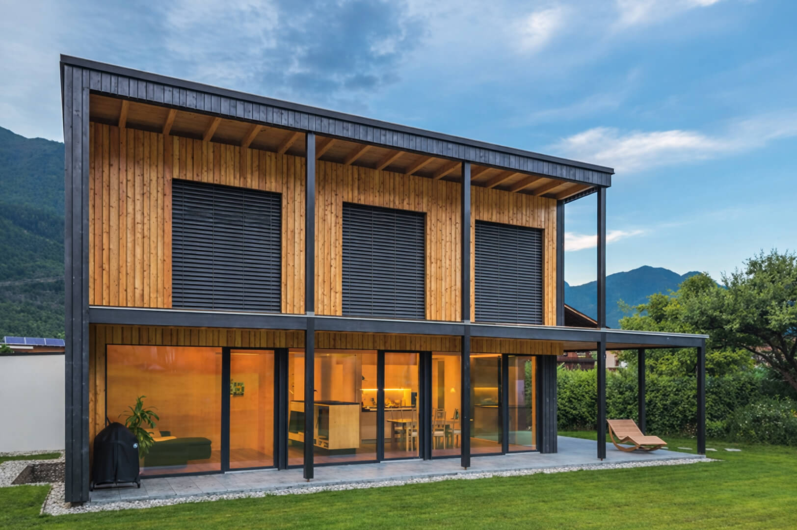 Modern Kneisl Ganahl house with wood stain in natural surroundings.